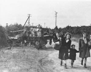 1st Army Front Knocked Out German panzer jaeger Marder II with French Female Refugee Civilians Normandy France 061244  (1 of 1)