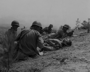 Corpsmen work on a wounded Marine during the 2nd Battle of the Naktong River, September 3, 1950.