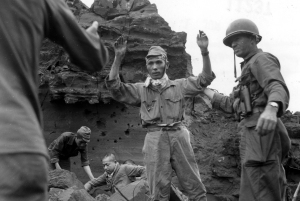 Men of the 147th capture a Japanese hold out on Iwo Jima during their three month long ordeal on the volcanic island.